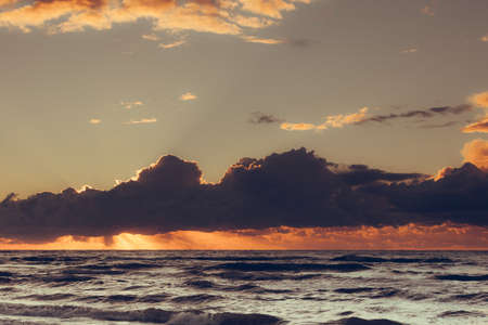 Beautiful seascape evening Baltic sea sunset horizon and cloudy sky. Tranquil scene. Natural background. Landscape.の写真素材