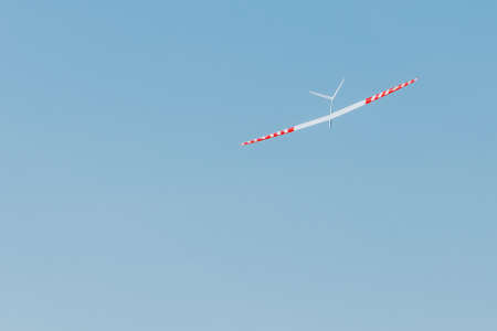 RC remotely controlled soaring plane model sailplane on blue sky in brisk windの写真素材