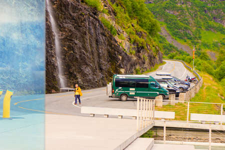 Tourism vacation and travel. Male tourist on Flydalsjuvet viewpoint, Norway Scandinavia.