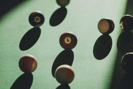 Billiard cue balls on green table. Pool game
