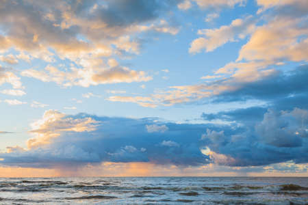 Beautiful seascape evening Baltic sea sunset horizon and cloudy sky. Tranquil scene. Natural...