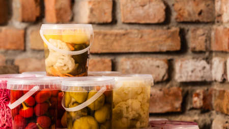 Food preserving for autumn winter time. Jars with pickled vegetables in cellarの写真素材
