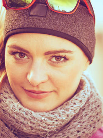Sporty woman portrait outdoors. Fitness girl wearing warm sporty clothes in cold dayの写真素材