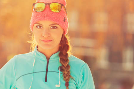 Sporty girl showing her beauty. Staying fit and war in winter. Health nature fitness fashion concept.の写真素材