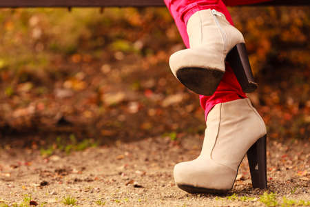Clothing fashion concept. Autumnal shoes in the park. Stylish footwear.の写真素材