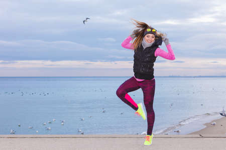 Sports and activities. Slim fit fitness woman outdoor. Athlete happy smiling girl training wearing...