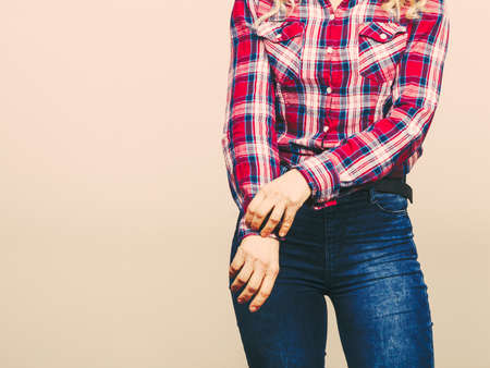 Female body wearing jeans pants plaid shirt, studio shotの写真素材