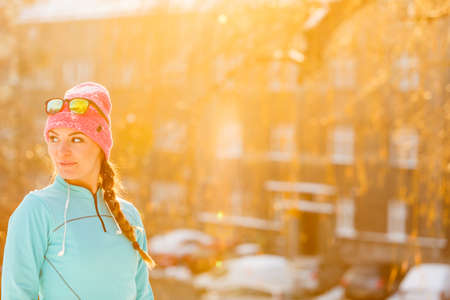Winter sport and female fashion. Choosing good sportswear for chilling temperatures. Health fitness safety concept.の写真素材