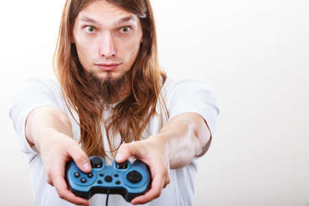 Lifestyle of young people. Student man spending time on playing games videogames console  . Long...