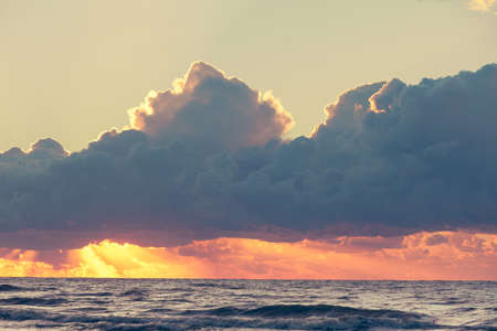 Beautiful seascape evening Baltic sea sunset horizon and cloudy sky. Tranquil scene. Natural background. Landscape.の写真素材