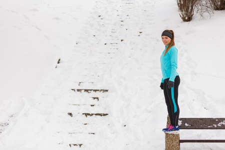 Outdoors activities people spare time concept. Young woman outside during winter. Attractive girl...