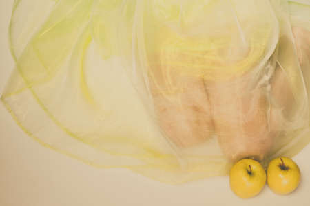 Nutrition wellness and nature.. Female wearing green dress sit presenting fruits healthy eating lifestyle.の写真素材