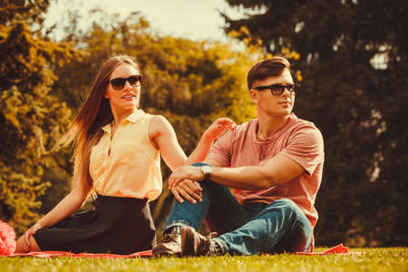 Love romance relationship dating leisure concept. Playful girl with her man. Young lady with boyfriend in park.の写真素材