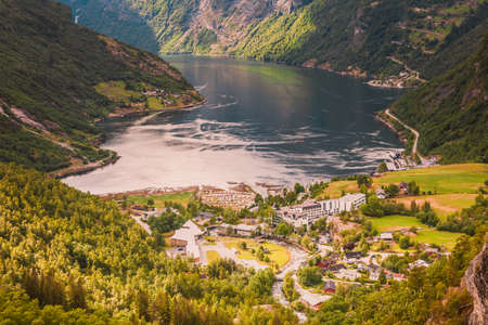 Tourism vacation and traveling. Fantastic view on Geirangerfjord green mountains landscape and village Geiranger, travel destination in Norway Scandinavia.の写真素材