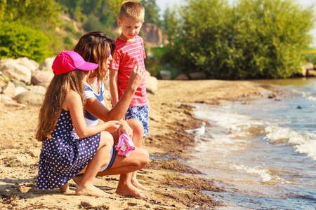 Summer holidays and common travel. Lovely happy active family on vacation trip. Relatives spending enjoyable good time together.の写真素材