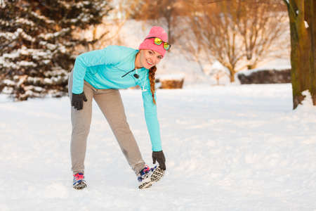 Girl staying in shape in winter, maintainig weight and curves during winter time. Fitness health fashion nature conceptの写真素材