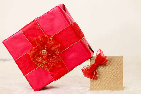 Two gift boxes red and golden. Christmas time concept.