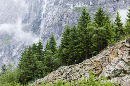 Norway hiking area, scenic mountains landscape in summer by misty foggy rainy weatherの写真素材