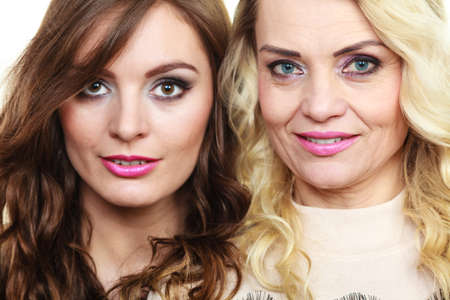 Generation relationship concept. Portrait adult daughter with mother. Two beautiful elegant women,...