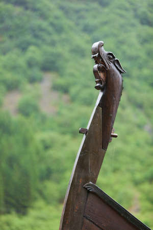 Part of old wooden viking boat in norwegian nature. Tourism and traveling concept