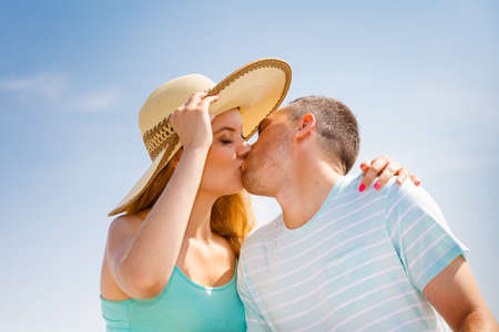 Relationship goals, outdoor relaxation, love and friendship concept. Man and woman sitting together outside hugging, having date.の写真素材