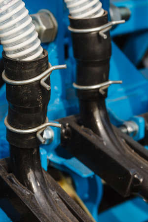 Machines, production concept. Detailed closeup of white flexible plastic hose, pipes.の写真素材