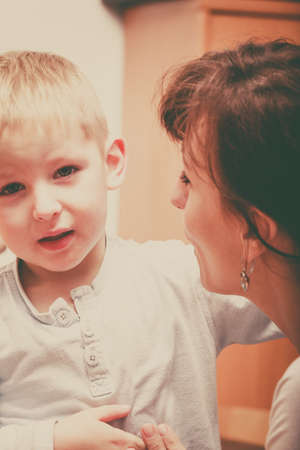 Family love, beauty of parenting concept. Mother hugging her son, little young boy.