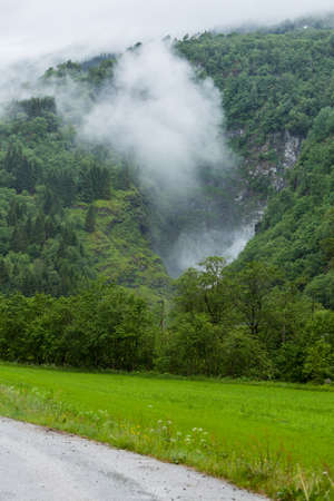 Norway hiking area, scenic mountains landscape in summer by misty foggy rainy weatherの写真素材