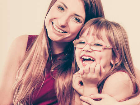 Happiness and love. Family relationships. Happy smiling mother with joyful daughter. Positive feelingsの写真素材