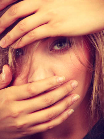 emotions embarrassment awkwardness gestures concept ashamed blonde woman covering her face with...