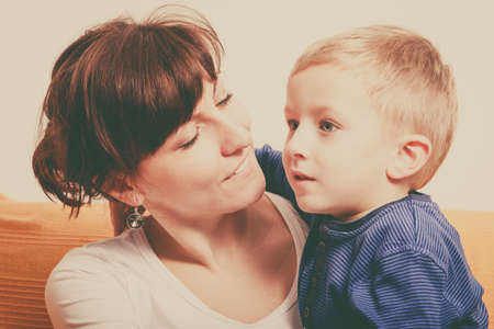 Family love, beauty of parenting concept. Mother hugging her son, little young boy.の写真素材