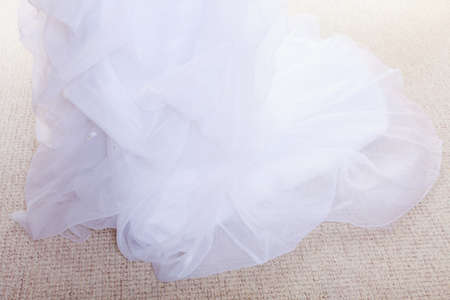 Fashion, clothes, clothing concept. Closeup woman white long wedding dress. White isolated.の写真素材