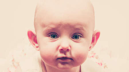 Lovely little child girl. Portrait of cute beauty sweet baby. Face emotion expression.の写真素材