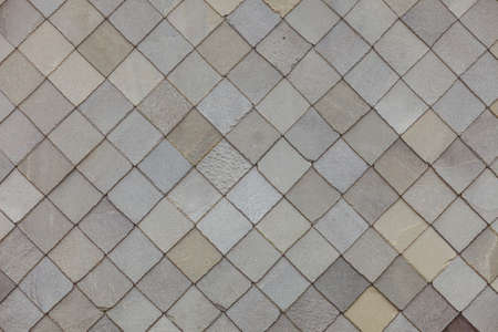 Brown stone tiles roof texture architecture background seamless pattern, detail of house close up