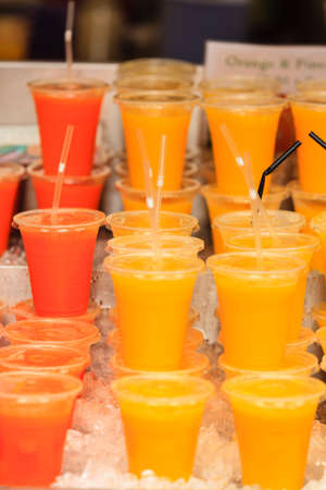 closeup food stall outdoor on street cold fruit juice drink takeaway at london marketの写真素材