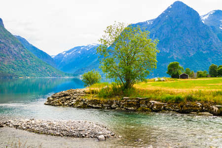 Tourism vacation and travel. Mountains landscape and lake Oppstrynsvatnet in Jostedalsbreen National Park, Oppstryn (Stryn), Sogn og Fjordane county. Norway Scandinavia.の写真素材