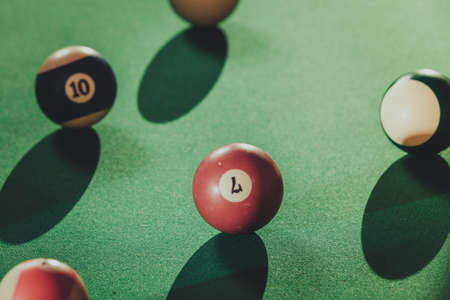 Billiard cue balls on green table. Pool gameの写真素材
