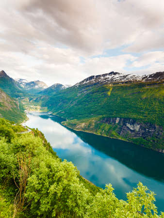 Tourism vacation and travel. Beautiful view over magical Geirangerfjorden from Flydalsjuvet viewpoint, Norway Scandinavia.の写真素材