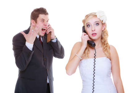 Relationship problems and troubles concept. Groom and bride calling to each other having quarrel argument.の写真素材