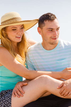 Relationship goals, outdoor relaxation, love and friendship concept. Man and woman sitting together...