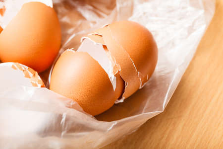 Kitchen food products details concept. Many empty cracked eggshells left after cooking.の写真素材