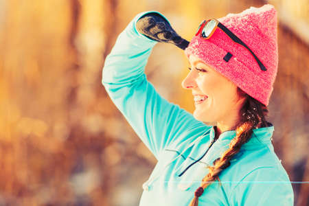 Winter sport and female fashion. Choosing good sportswear for chilling temperatures. Health fitness...