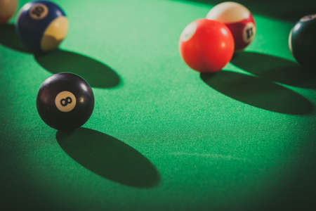 Billiard cue balls on green table. Pool gameの写真素材