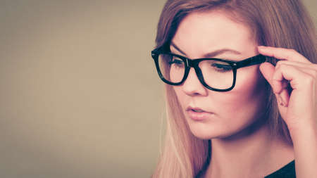 Intellectual expressions, being focused concept. Closeup of attractive woman thinking face expressionの写真素材