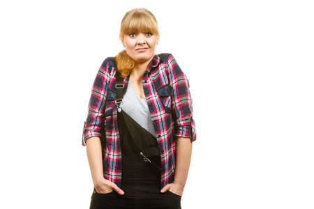 Gardening fahion concept. Attractive woman in pink check shirt and dungarees, shocked surprised face expression. Isolated backgroundの写真素材