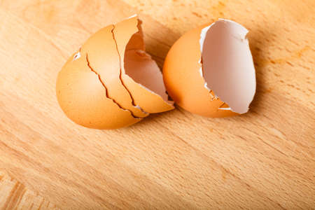 Kitchen food products details concept. Detailed closeup of empty cracked eggshells left after...