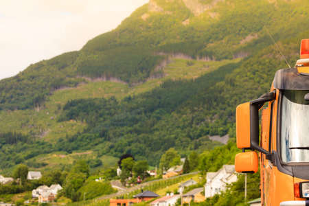 Industry, road construction. Part of heavy duty excavator machine, digger bucket bulldozer outdoor, nature mountains in the backgroundの写真素材