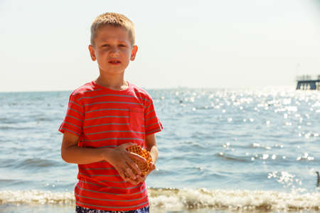 Leisure and free time concept. Portrait of little boy spending time outside on fresh air. Male kid outdoor on holidays vacation.の写真素材