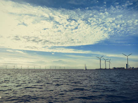 Wind turbines generator farm for renewable sustainable and alternative energy production along coast baltic sea near Denmark. Eco power, ecology.の写真素材