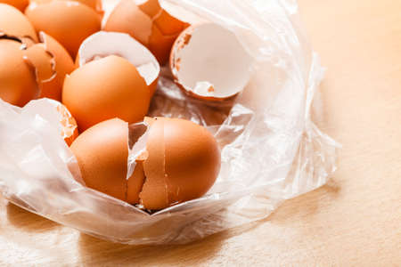 Kitchen food products details concept. Many empty cracked eggshells left after cooking.